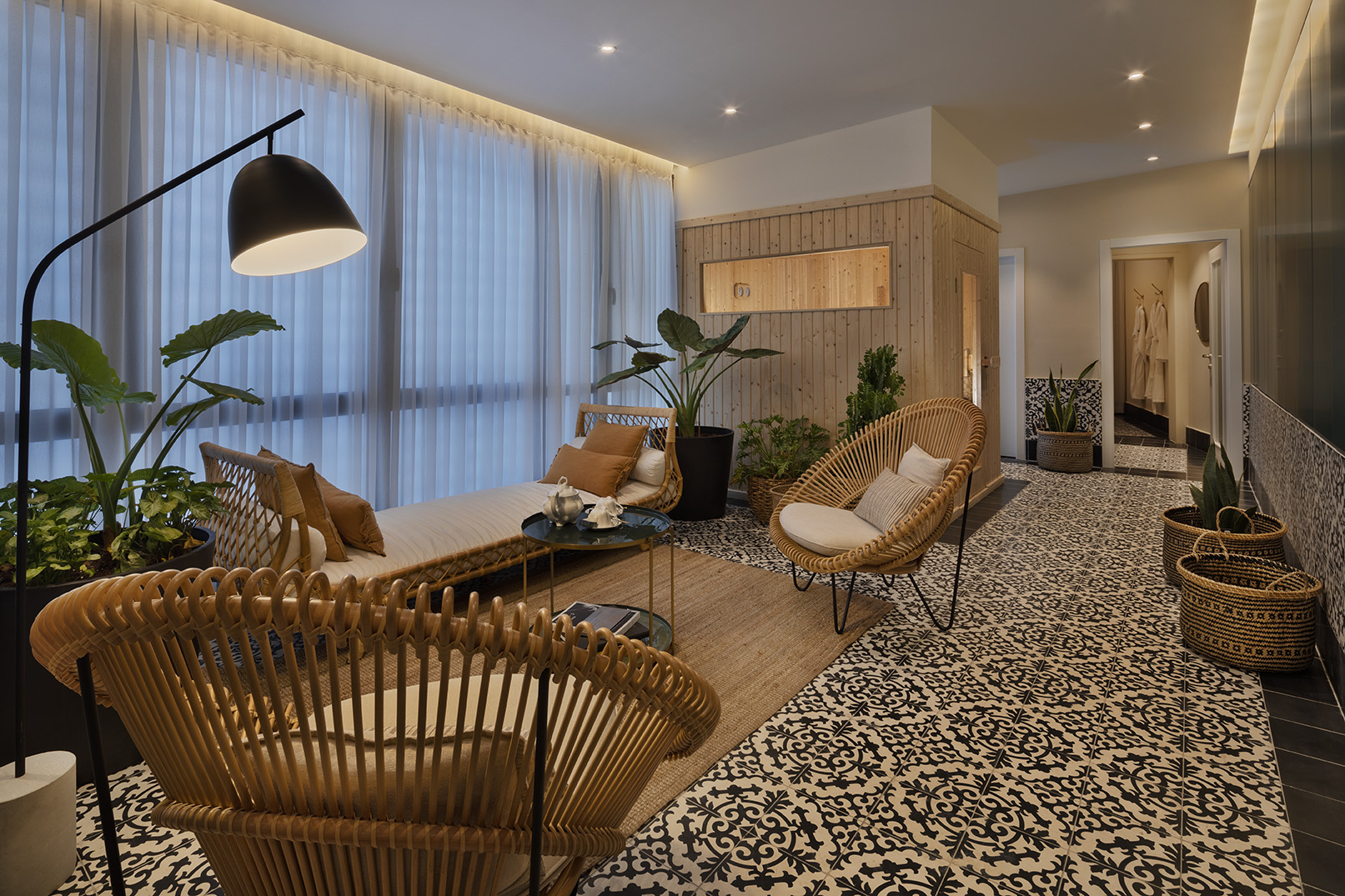 Renoma spa lounge with rattan seating and soft lighting